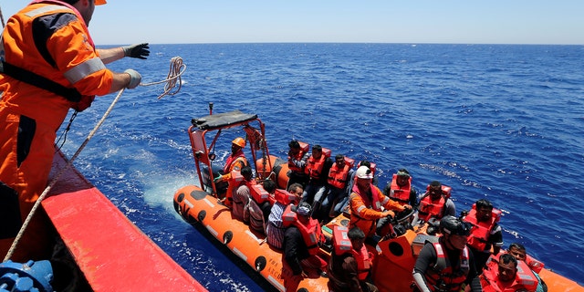 Migrants are rescued by "Save the Children" NGO crew from the ship Vos Hestia in the Mediterranean sea off Libya coast, June 15, 2017.  REUTERS/Stefano Rellandini - RTS1792D