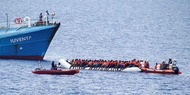 Migrants on a dinghy are rescued by German NGO Jugend Rettet ship "Juventa" crew in the Mediterranean sea, off the coast of Libya June 18, 2017. Italy accuses the NGO of working in cahoots with traffickers.