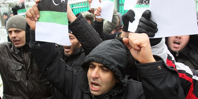 Feb. 22, 2011: A Libyan citizens in Serbia protest against Moammar Gadhafi in front of the embassy in Belgrade, Serbia. About 30 Libyans gathered at the protest against Gadhafi's crackdown on peaceful protesters in Libya.