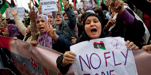 March 9, 2011: Libyan women protest to demand the resignation of Libyan leader Muammar al-Qaddafi and for a no-fly zone during a demonstration in Benghazi, eastern Libya.