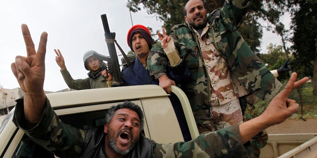 Feb. 27, 2011: Anti-Lybian leader gunmen celebrate the freedom of the Libyan city of Benghazi, Libya. U.S. President Barack Obama has called on Libyan dictator Muammar Qaddafi to leave power immediately.