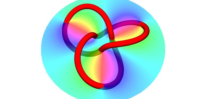 By reflecting a laser beam from a specially designed hologram (shown here as the colored circle), physicists created knots of dark filaments (represented by the colored knot).