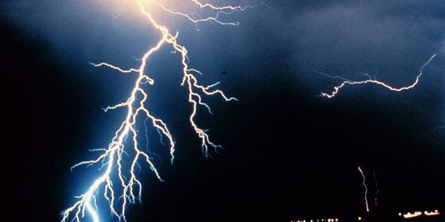 Multiple cloud-to-ground and cloud-to-cloud lightning strokes during night-time.