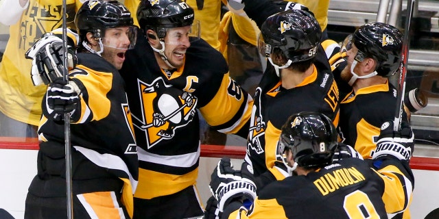 May 16, 2016: Pittsburgh Penguins' Sidney Crosby, second from left, celebrates with teammates Matt Cullen (7), Brian Dumoulin (8), Kris Letang (58) and Patric Hornqvist. right, after scoring the game-winning goal in overtime of Game 2 of the Eastern Conference final against the Tampa Bay Lightning.