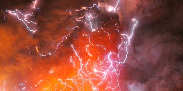 File photo - Volcanic lightning or a dirty thunderstorm is seen above Shinmoedake peak as it erupts, between Miyazaki and Kagoshima prefectures, in this photo taken from Kirishima city and released by Minami-Nippon Shimbun Jan. 28, 2011. (REUTERS/Minami-Nippon Shimbun/Handout)