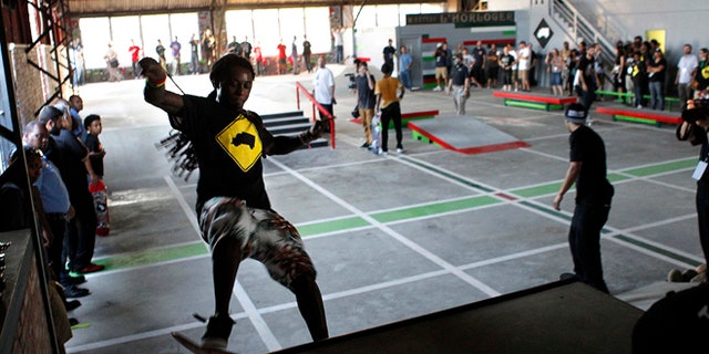 Sept. 26, 2012: Recording artist Lil Wayne skates in a new skateboard park he helped finance along with Glu Agency and Mountain Dew, in the Lower Ninth Ward of New Orleans.