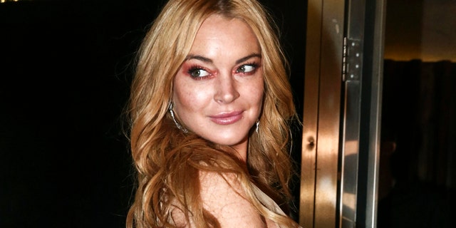 Lindsay Lohan owe back taxes to the government. Here the actress poses for photos at the entrance of the Lohan Nightclub  in Athens, Greece, October 2016.