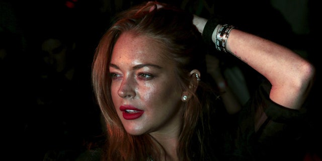 Lindsay Lohan teased her return to films with a movie poster for her upcoming film "The Shadow Within."