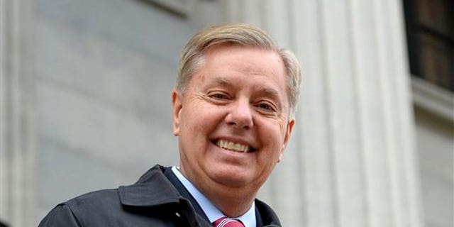 FILE - In this Jan. 14, 2015 file photo, Sen. Lindsey Graham, R- S.C., walks down the steps of the State Capitol building in Columbia, S.C.  Republican presidential candidate Lindsey Graham has announced Monday he is ending his bid for the GOP nomination. (AP Photo/Richard Shiro)