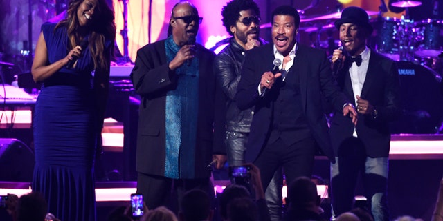Feb 13, 2016. Honoree Lionel Richie performs at the MusiCares Person of the Year tribute at the Los Angeles Convention Center. Pictured from left are Yolanda Adams, Stevie Wonder, Lenny Kravitz and Pharrell Williams.