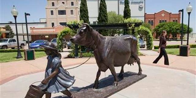 April 21, 2015: A woman walks by the Blue Bell Creameries on in Brenham, Texas.