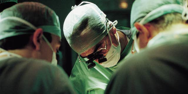 Surgeons during liver transplant surgery.