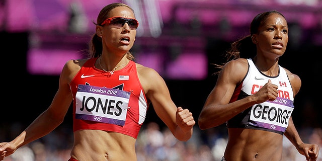 Aug. 6: United States' Lolo Jones, left, and Canada's Phylicia George compete in a women's 100-meter hurdles heat during the athletics in the Olympic Stadium at the 2012 Summer Olympics in London. (AP)
