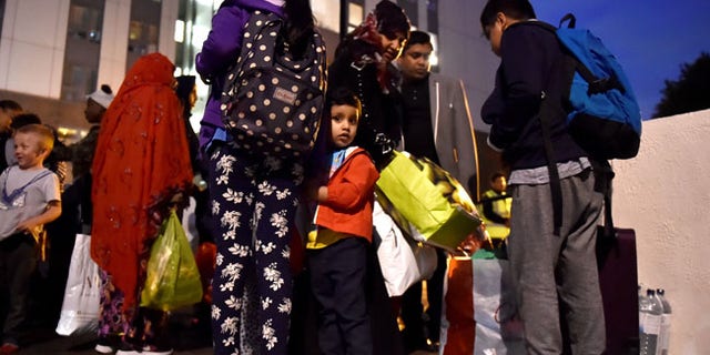 Residents are evacuated from the Taplow Tower residential block as a precautionary measure following concerns over the type of cladding used on the outside of the building on the Chalcots Estate in north London, Britain, June 23, 2017. REUTERS/Hannah McKay - RTS18EWW