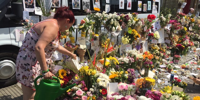 The makeshift shrine in honor of the victims of the fire.
