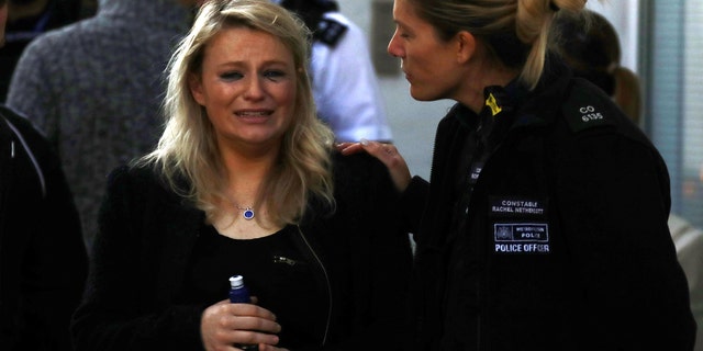 A woman reacts outside Parsons Green tube station in London, Britain September 15, 2017. REUTERS/Kevin Coombs TPX IMAGES OF THE DAY - RC1223D70F10