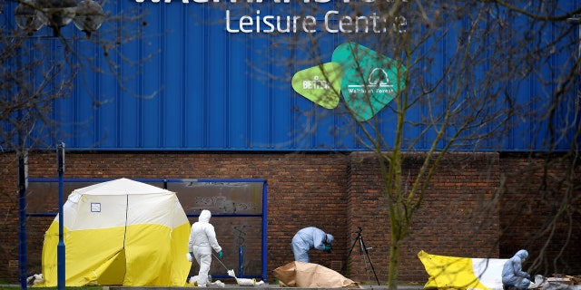 Forensic investigators examine a car on Chalgrove Road, where a teenage girl was murdered, in Tottenham, Britain, April 3, 2018