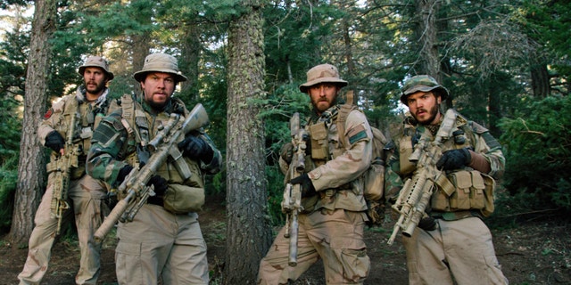 From left, Taylor Kitsch, as Michael Murphy, Mark Wahlberg as Marcus Luttrell, Ben Foster as Matt Axe Axelson, and Emile Hirsch as Danny Dietz in "Lone Survivor."