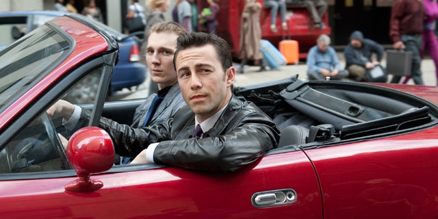 Joseph Gordon-Levitt, foreground, and Paul Dano in a scene from the action thriller "Looper"