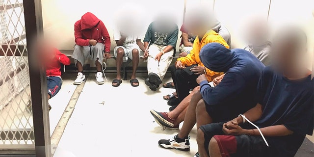 Looting suspects sit in Miami jail