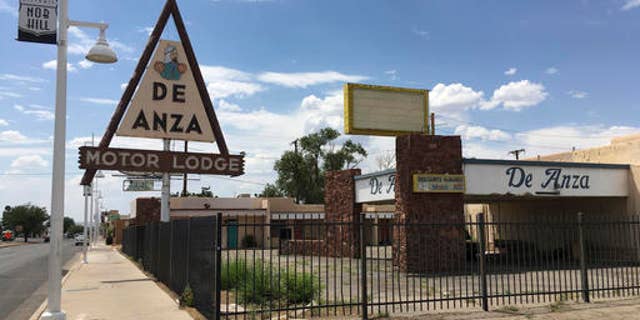 FILE - This June 24, 2016 file photo, shows the abandoned De Anza Motor Lodge in Albuquerque, N.M., along Route 66. Some sites linked to key moments of the nation's civil rights are overlooked, neglected and at-risk of being forgotten. In another part of New Mexico, there is a ghost town of a once thriving all-black settlement in the New Mexico desert rarely appears on tourist maps. (AP Photo/Russell Contreras, File)