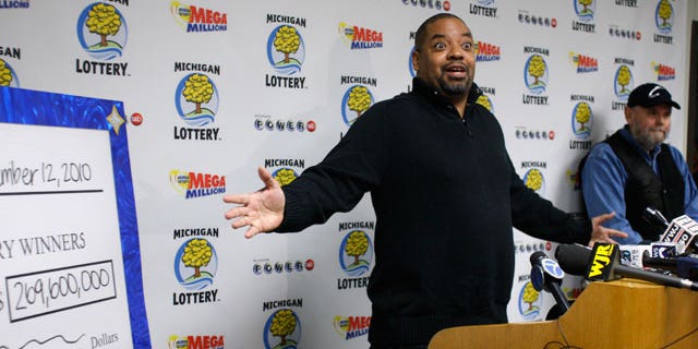 Mike Greer talks about his "Team Victory" group's $128.6 million winning lottery ticket during a news conference Friday, Nov. 12, 2010, in Lansing, Mich. A $129 million Powerball lottery ticket sold at an urban porn shop is being split by members of a group primarily from southeast Michigan. Separately, Steve Mays of Gladstone, Mich., right, came forward to claim a Mega Millions jackpot worth $141 million. The retiree, who wouldn't disclose his age, bought the ticket at a convenience store. He said he hasn't decided what to do with his winnings, which he will take in 26 annual installments of $5.4 million.