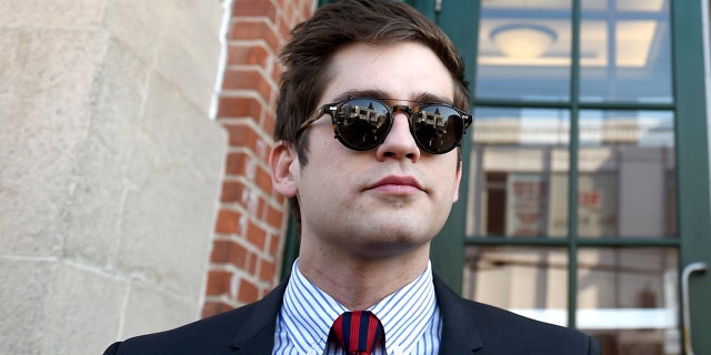 Lucian Wintrich, left, White House correspondent for the right-wing blog Gateway Pundit, takes questions from the media with his attorney Norman Pattis, right, outside Rockville Superior Court in Vernon, Conn., Monday, Dec. 11, 2017.