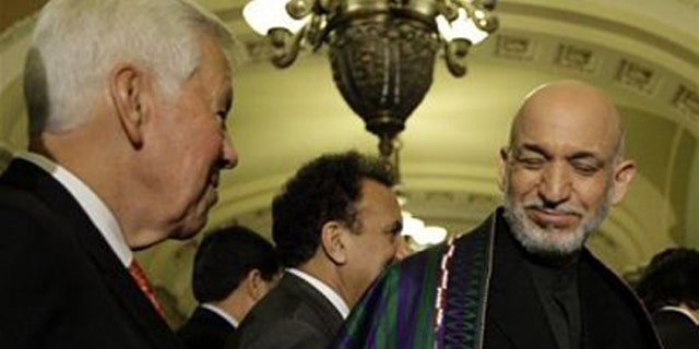 Sen. Richard Lugar talks with Afghanistan President Hamid Karzai at a news conference on Capitol Hill. (AP Photo)