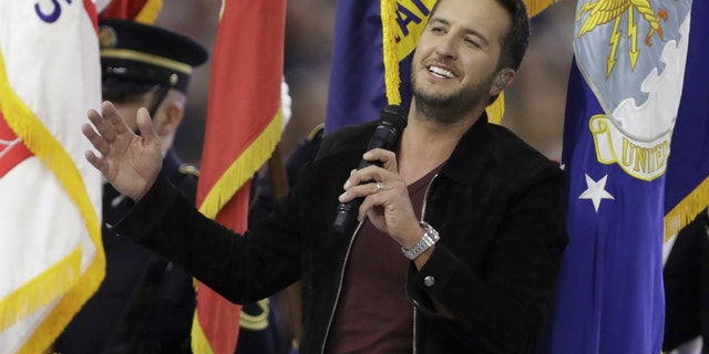 Country music singer Luke Bryan sings the National Anthem, before the NFL Super Bowl 51 football game between the New England Patriots and the Atlanta Falcons, Sunday, Feb. 5, 2017, in Houston.