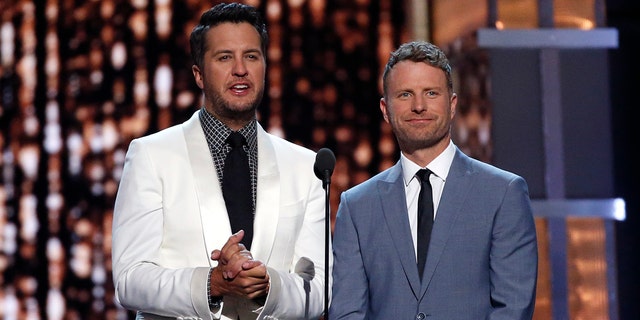 Luke Bryan (L) and Dierks Bentley host the 52nd Academy of Country Music Awards in Las Vegas, Nevada on April 2, 2017.