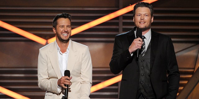 Hosts Luke Bryan, left, and Blake Shelton speak on stage at the 49th annual Academy of Country Music Awards at the MGM Grand Garden Arena on Sunday, April 6, 2014, in Las Vegas. (Photo by Chris Pizzello/Invision/AP)