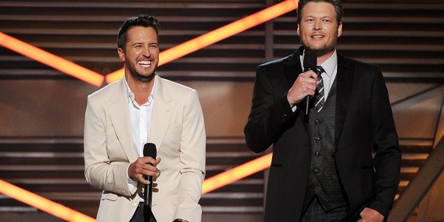 Hosts Luke Bryan, left, and Blake Shelton speak on stage at the 49th annual Academy of Country Music Awards at the MGM Grand Garden Arena on Sunday, April 6, 2014, in Las Vegas. (Photo by Chris Pizzello/Invision/AP)