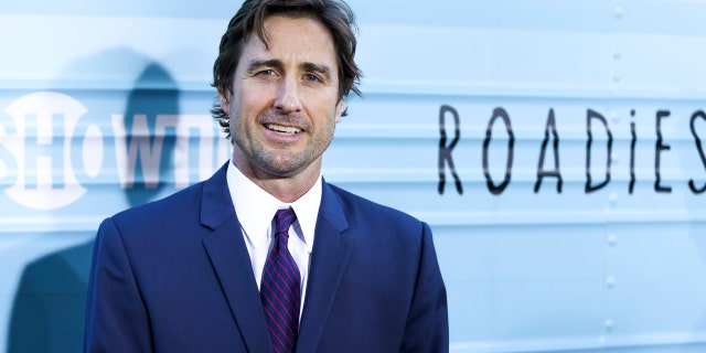 Luke Wilson helped pull a woman from a burning vehicle, a witness said.