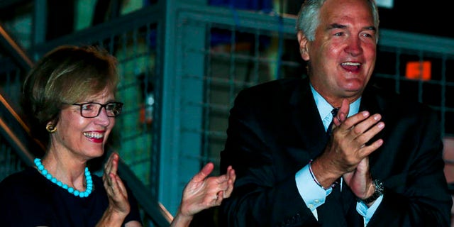 Sen. Luther Strange and his wife Melissa thank supporters after forcing a runoff against former Chief Justice Roy Moore, Tuesday, Aug. 15, 2017, in Homewood, Ala. (AP Photo/Butch Dill)