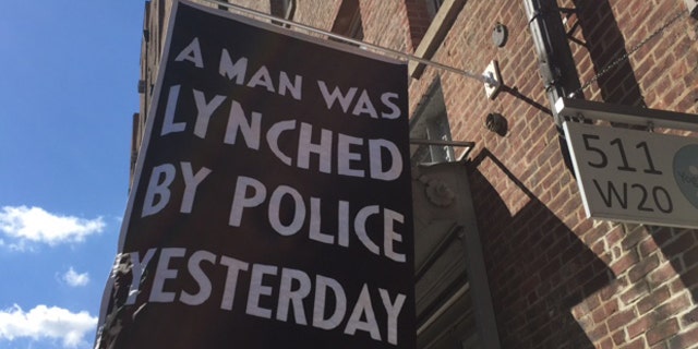 The art gallery's banner is stirring controversy, especially in the wake of last week's murder of five Dallas police officers. (FoxNews.com)