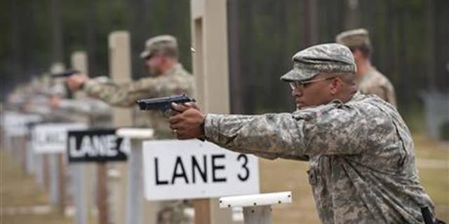 Members of the 139th Military Police Company train with their Beretta M9 at a range in Fort Stewart, Ga.