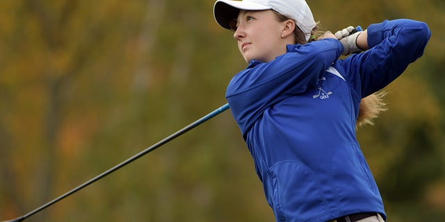 High school golfer Emily Nash tees off at the Central Mass. Division 3 Golf Tournament at Blissful Meadows.