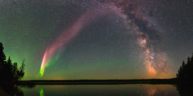 The majestic aurora-like phenomenon "Steve," now given the official acronym STEVE, shines with the Milky Way over Childs Lake, Manitoba in Canada.