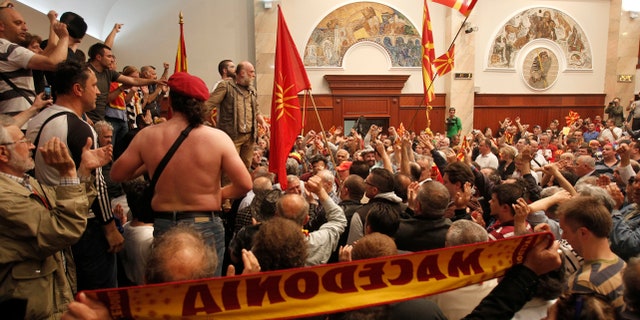 Protesters enter into the parliament building in Skopje, Macedonia, Thursday, April 27, 2017.