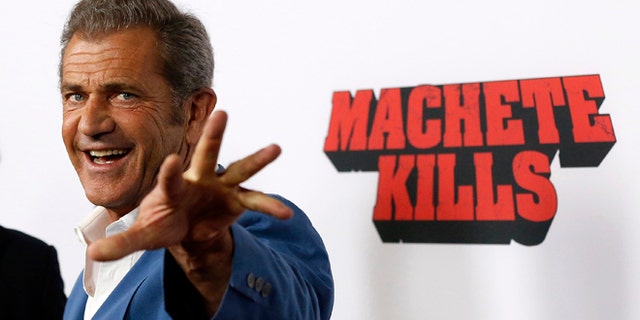 Cast member Mel Gibson poses at the premiere of "Machete Kills" in Los Angeles, California October 2, 2013. The movie opens in the U.S. on October 11. REUTERS/Mario Anzuoni (UNITED STATES - Tags: ENTERTAINMENT PROFILE) - RTR3FJHD