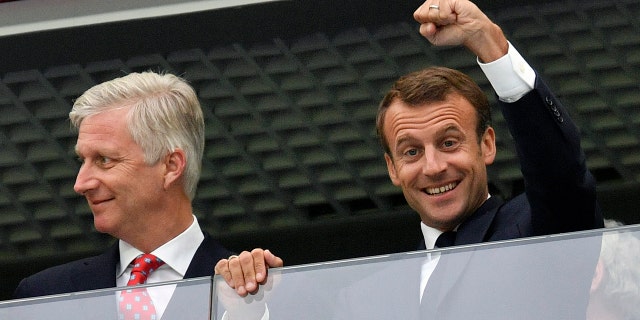 French President Emmanuel Macron and Belgian King Philippe watch the pre-match festivities in Saint Petersburg.