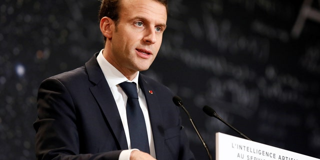 French President Emmanuel Macron delivers a speech during the Artificial Intelligence for Humanity event in Paris, March 29, 2018.