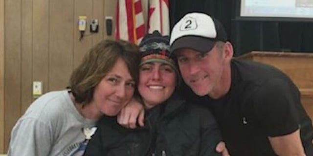Missing hiker Madeline Connelly 23, got hugs from her parents at Glacier Park Headquarters after being found.