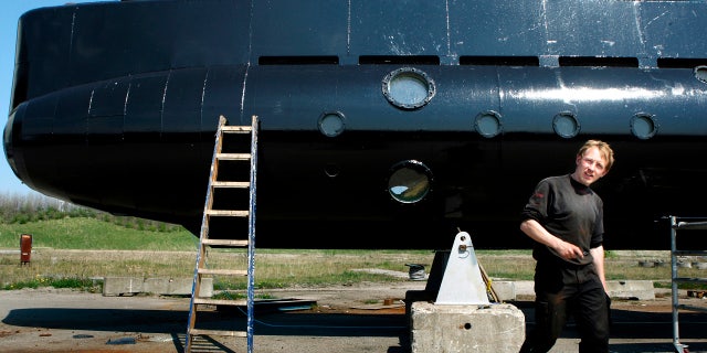 This April 30, 2008 file photo shows a submarine and its owner, Peter Madsen