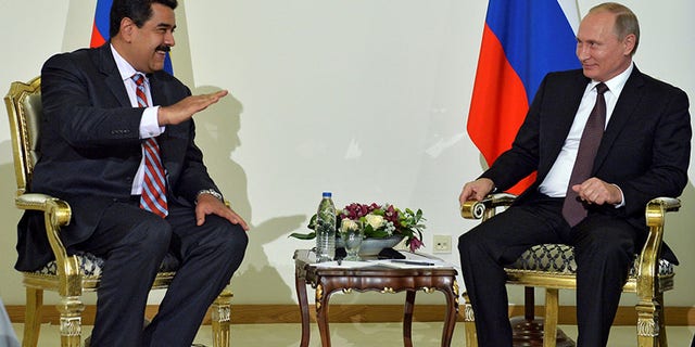 Venezuelan President Nicolas Maduro, left, and Russian President Vladimir Putin meet in Istanbul, Turkey, Oct. 10, 2016.