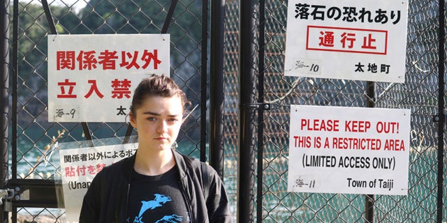 Maisie Williams at a beach known for dolphin hunting in Taiji, Japan.
