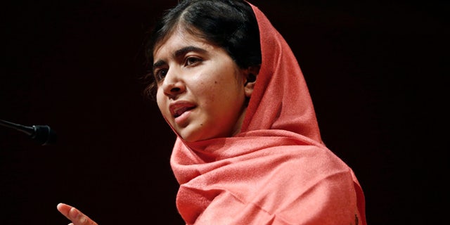 Sept. 27, 2013: In this file photo, Malala Yousafzai addresses students and faculty after receiving the 2013 Peter J. Gomes Humanitarian Award at Harvard University in Cambridge, Mass.