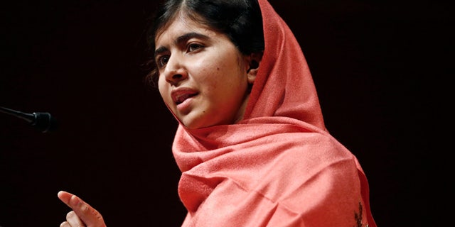 Sept. 27, 2013: In this file photo, Malala Yousafzai addresses students and faculty after receiving the 2013 Peter J. Gomes Humanitarian Award at Harvard University in Cambridge, Mass.