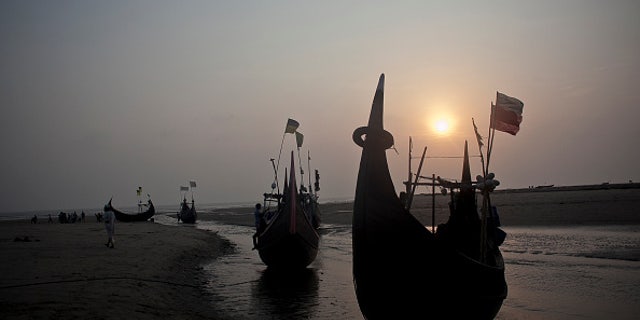 SHAMLAPUR, BANGLADESH - JULY 4: Fishing boats, like the kind that traffickers use, are seen on the beach July 4, 2015 in Shamlapur, Bangladesh. In the past months thousands of Rohingya have landed on the shores of Indonesia, Malaysia and Thailand, many of them by way of Bangladesh. The Rohingya pay up to $2,000 to traffickers, and they sail out from Bangladesh's southern coastline on fishing boats to meet larger ships in the deep sea that will take them to Malaysia. UNHCR estimates that there are more than 300,000 Rohingya living in Bangladesh. (Photo by Shazia Rahman/Getty Images)