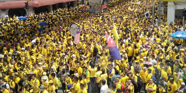 Protesters occupy a street during a rally in downtown Kuala Lumpur, Malaysia, Saturday, Nov. 19, 2016.